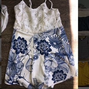 White lace romper with blue floral design